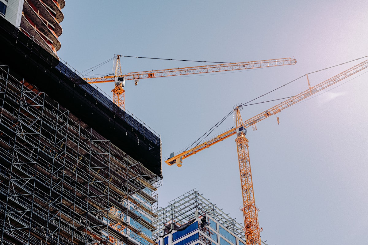 Aussie Construct building site with cranes and scaffolding