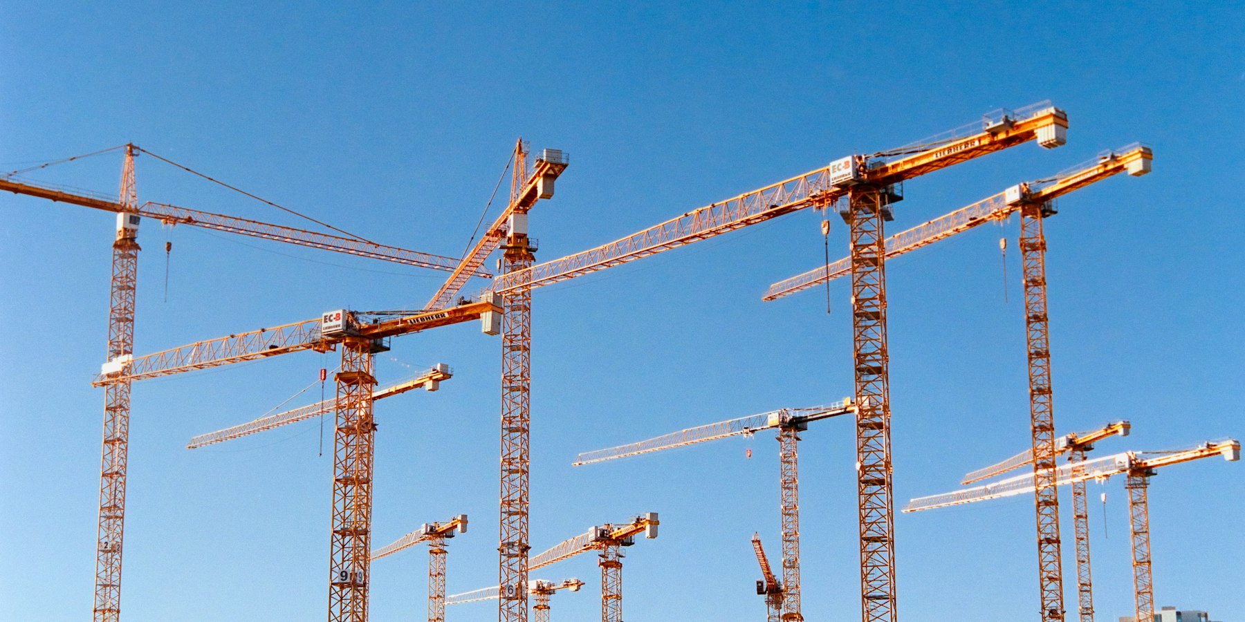 Construction cranes on an Aussie Construct project site
